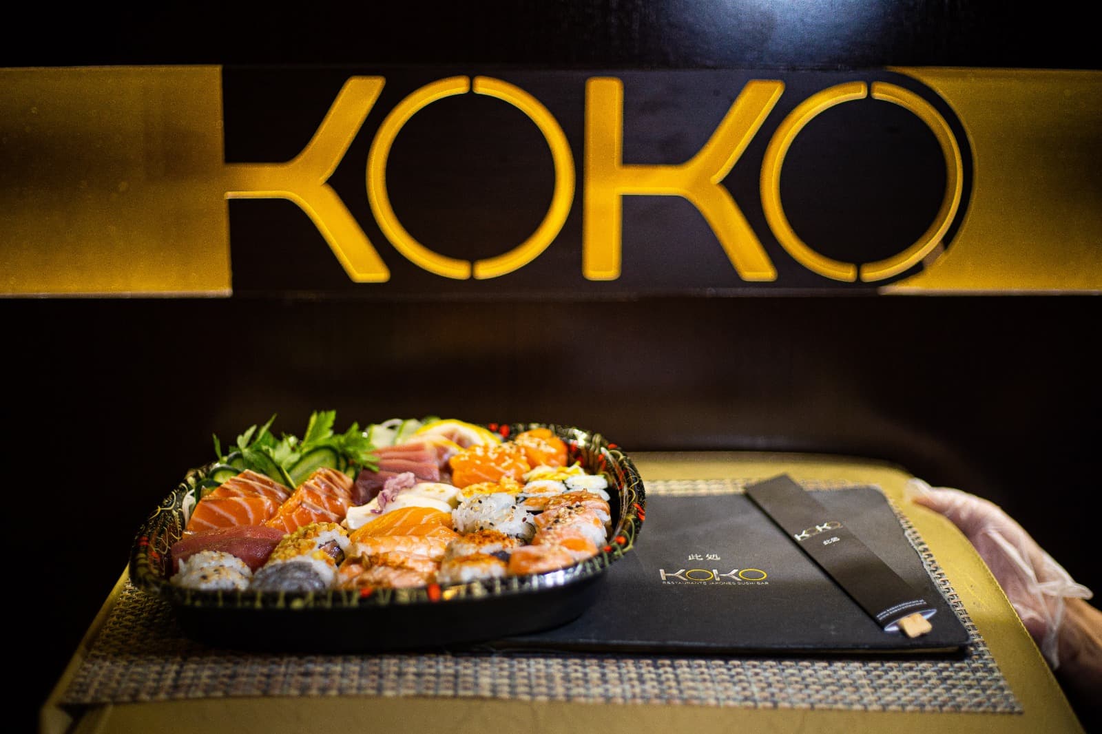 Koko sushi served under warm cinematic light
