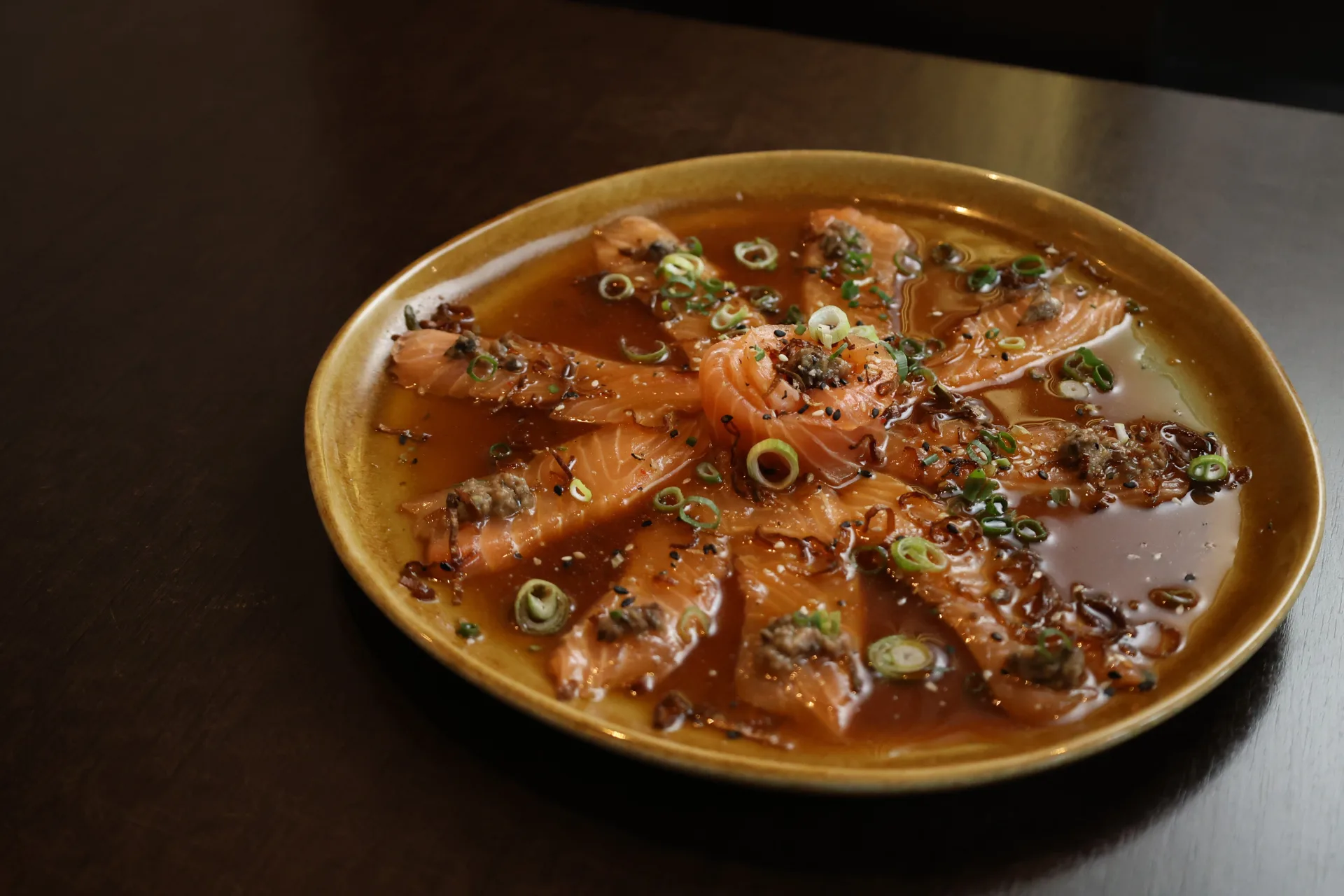 Salmon sashimi in the house sauce at Koko