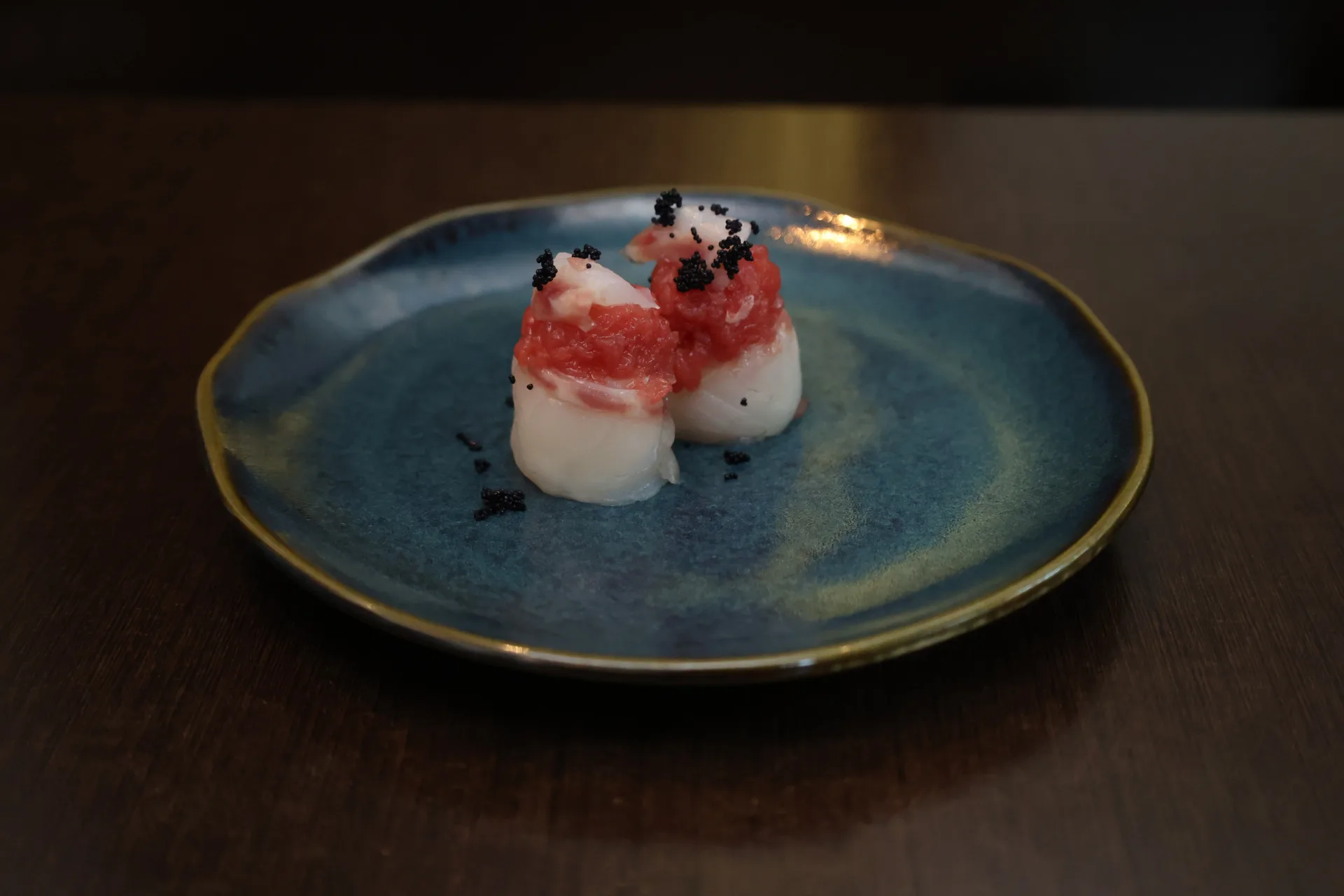 Scallop nigiri topped with tuna and tobiko at Koko