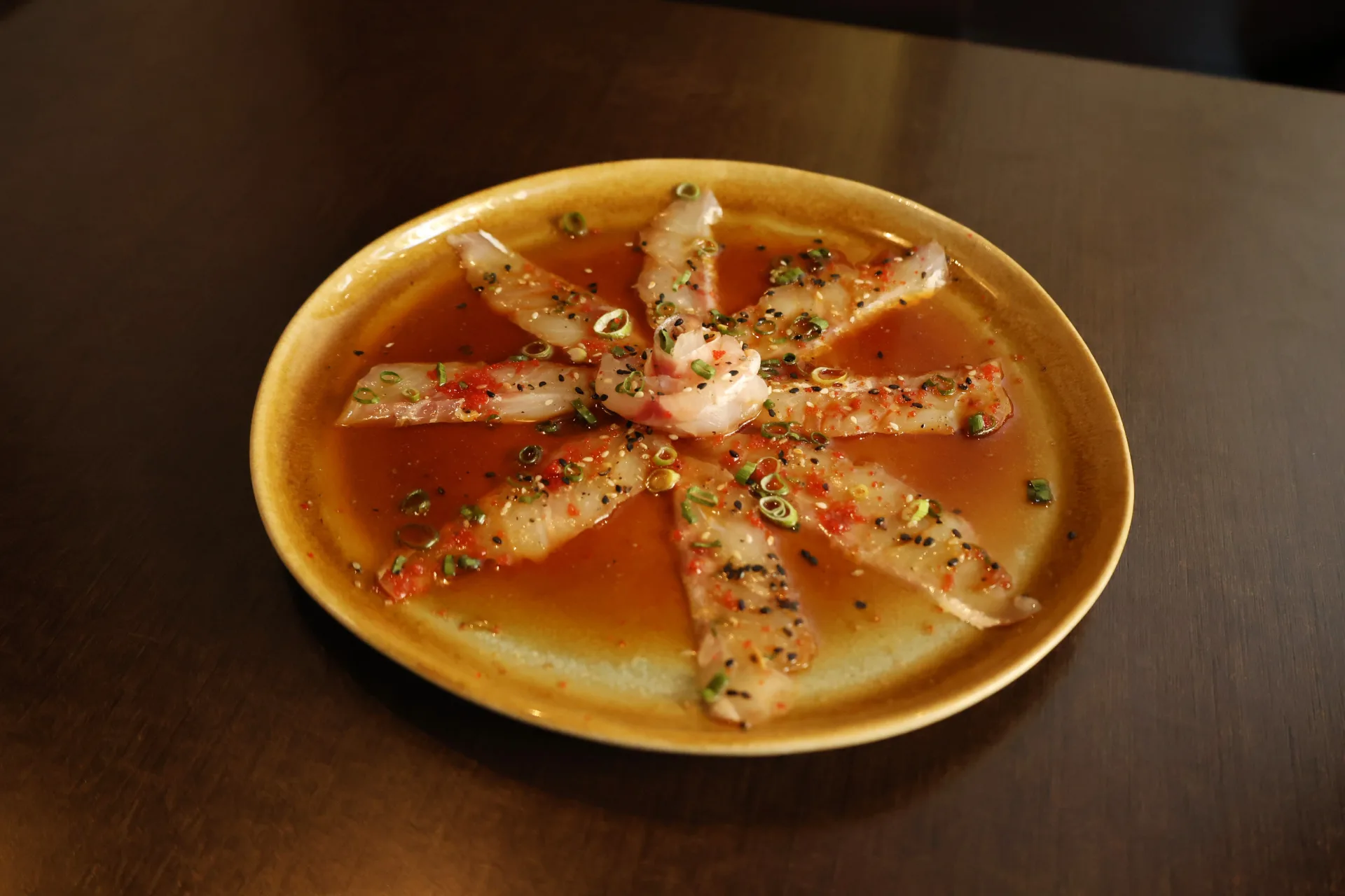 White fish sashimi in the house sauce at Koko