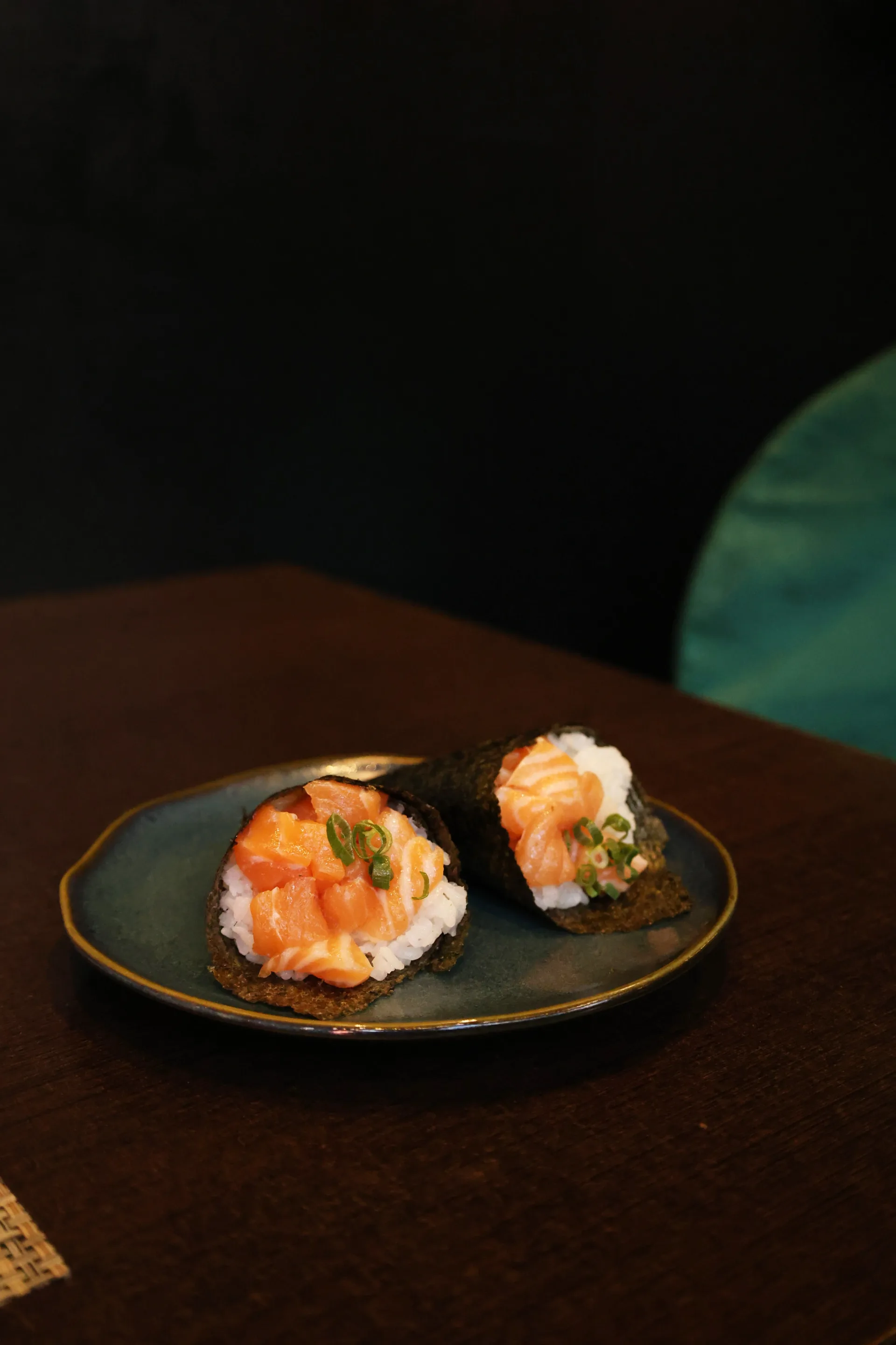 Two salmon temaki hand rolls served at Koko