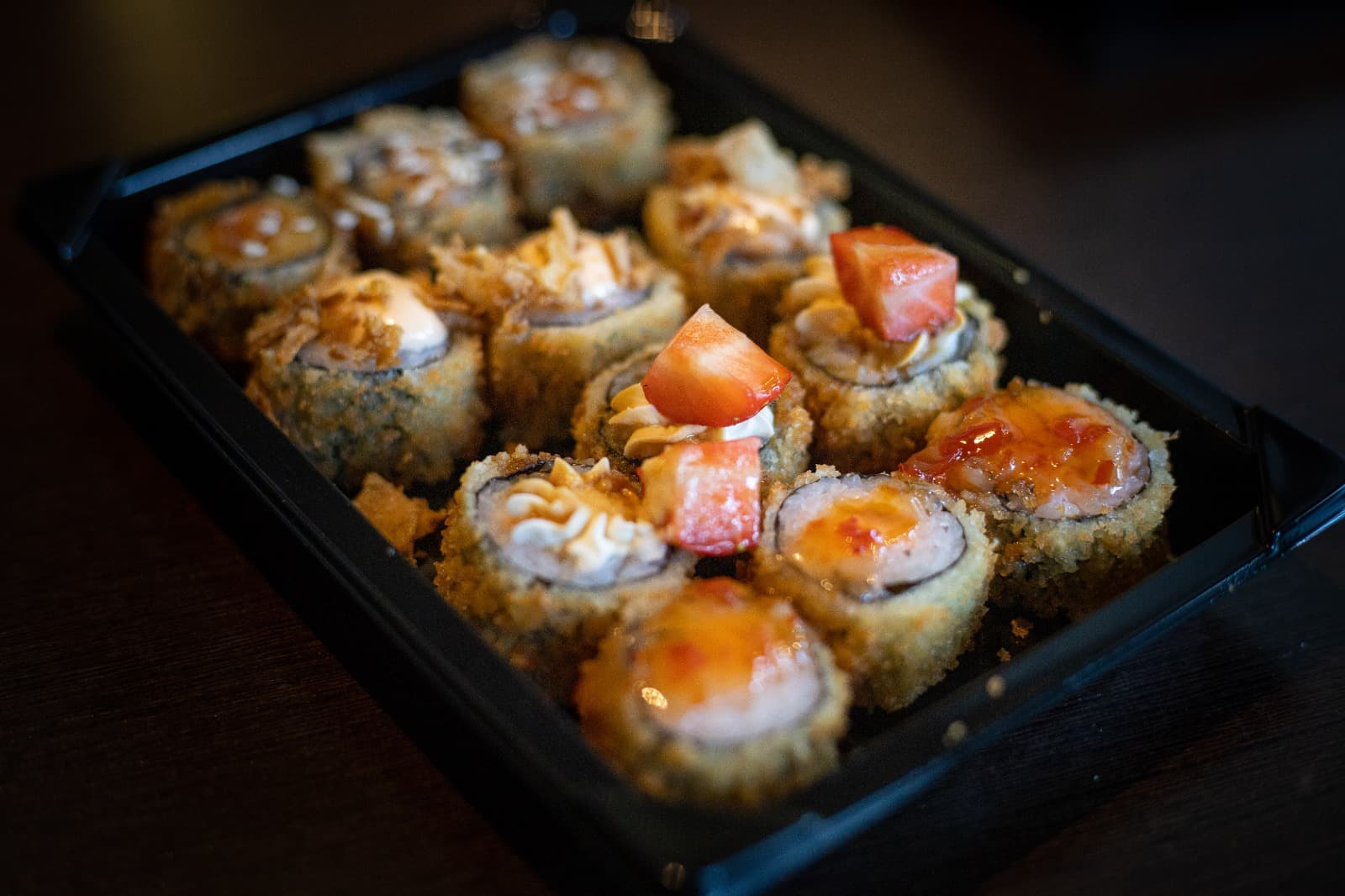 Assorted sushi rolls and sashimi